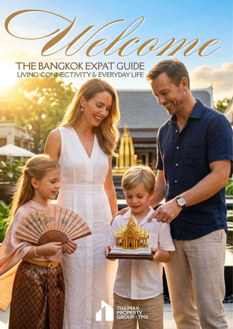 Family of four smiling outdoors; mother, father, a girl with a fan and a boy holding a golden temple model; warm, welcoming scene with 'Welcome' banner above.